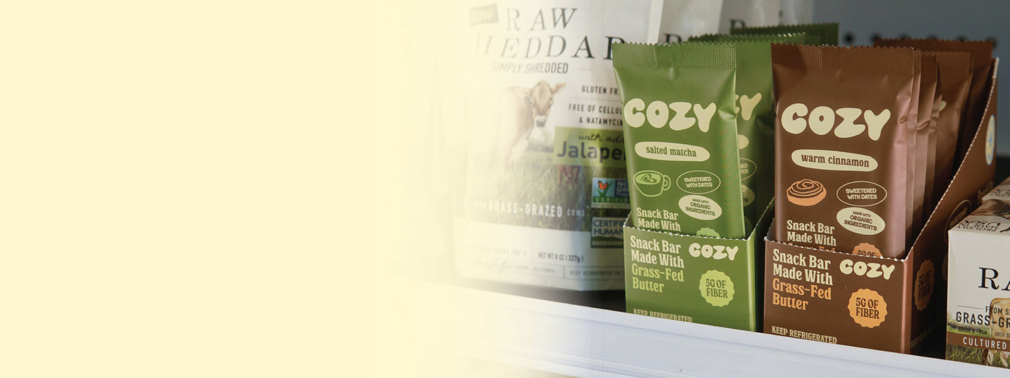 COZY refrigerated snack bars in warm cinnamon and salted matcha, made with grass-fed butter